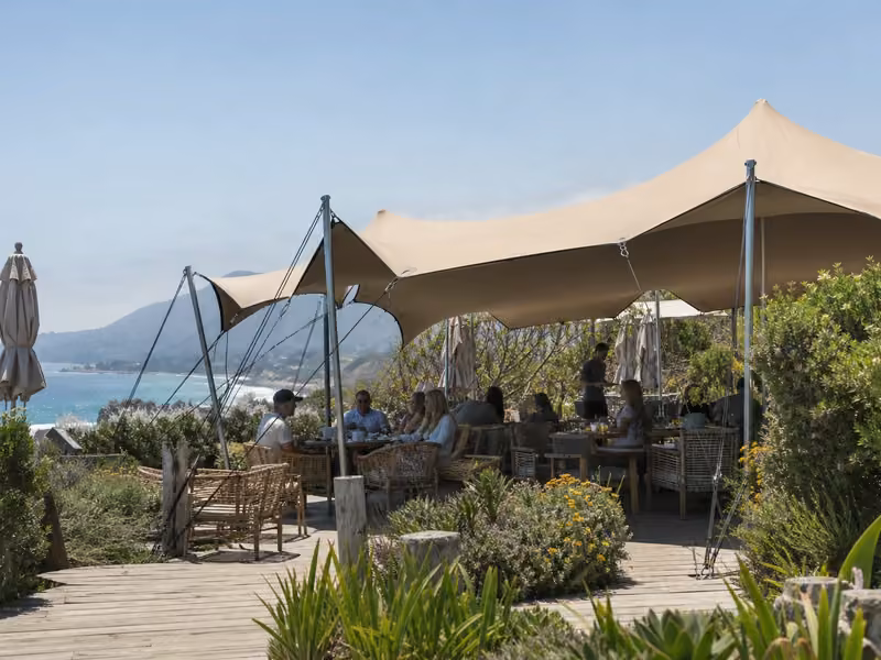 Custom multi-tent stretch tent compound at a beach resort