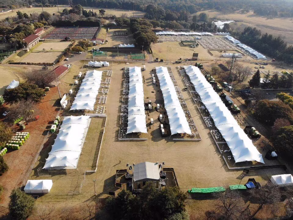Large event compound made from linked white stretch tent units
