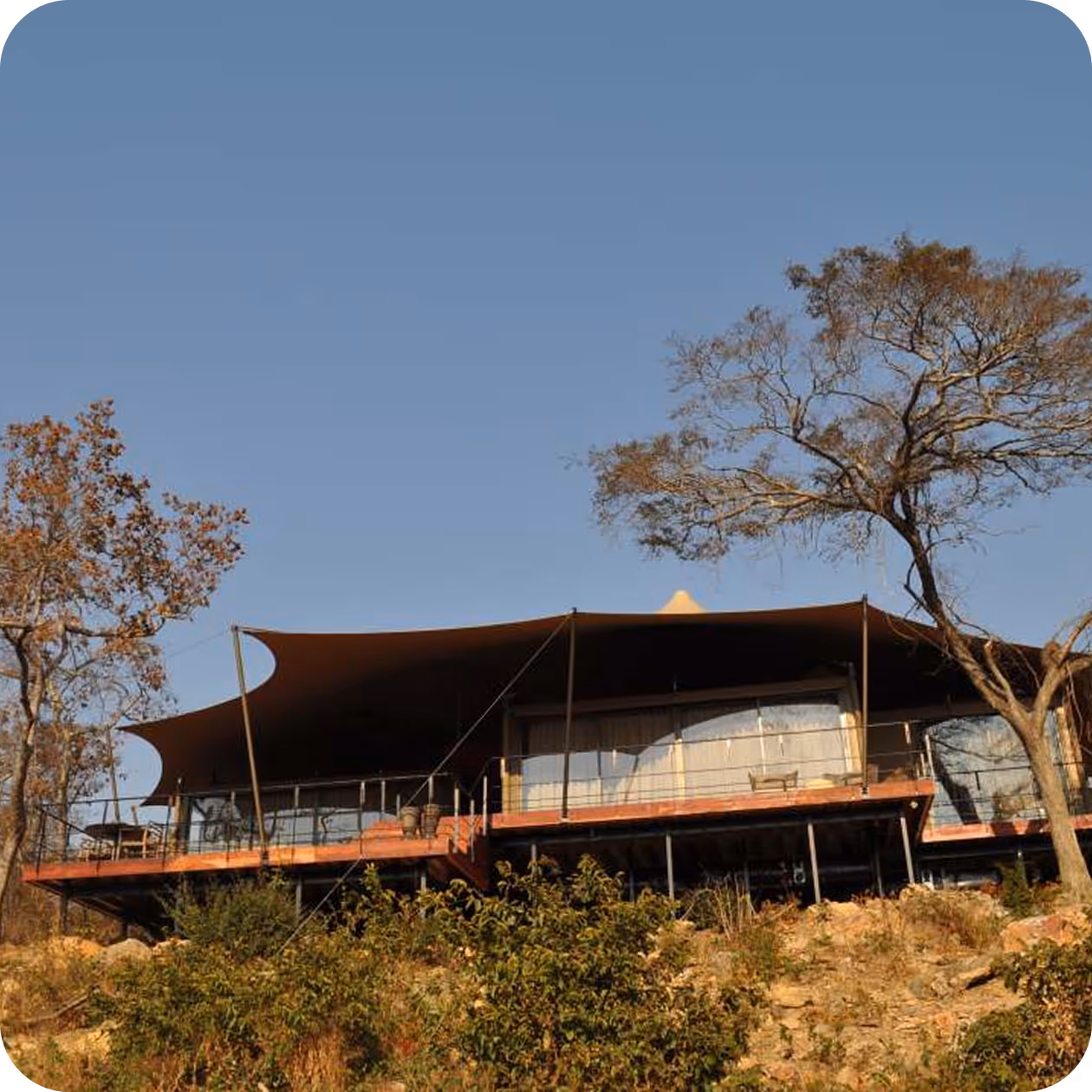 Freeform stretch canopy covering an outdoor corporate event space