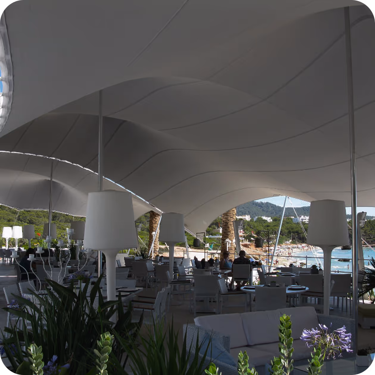 Stretch tent installation at a private garden party with guests